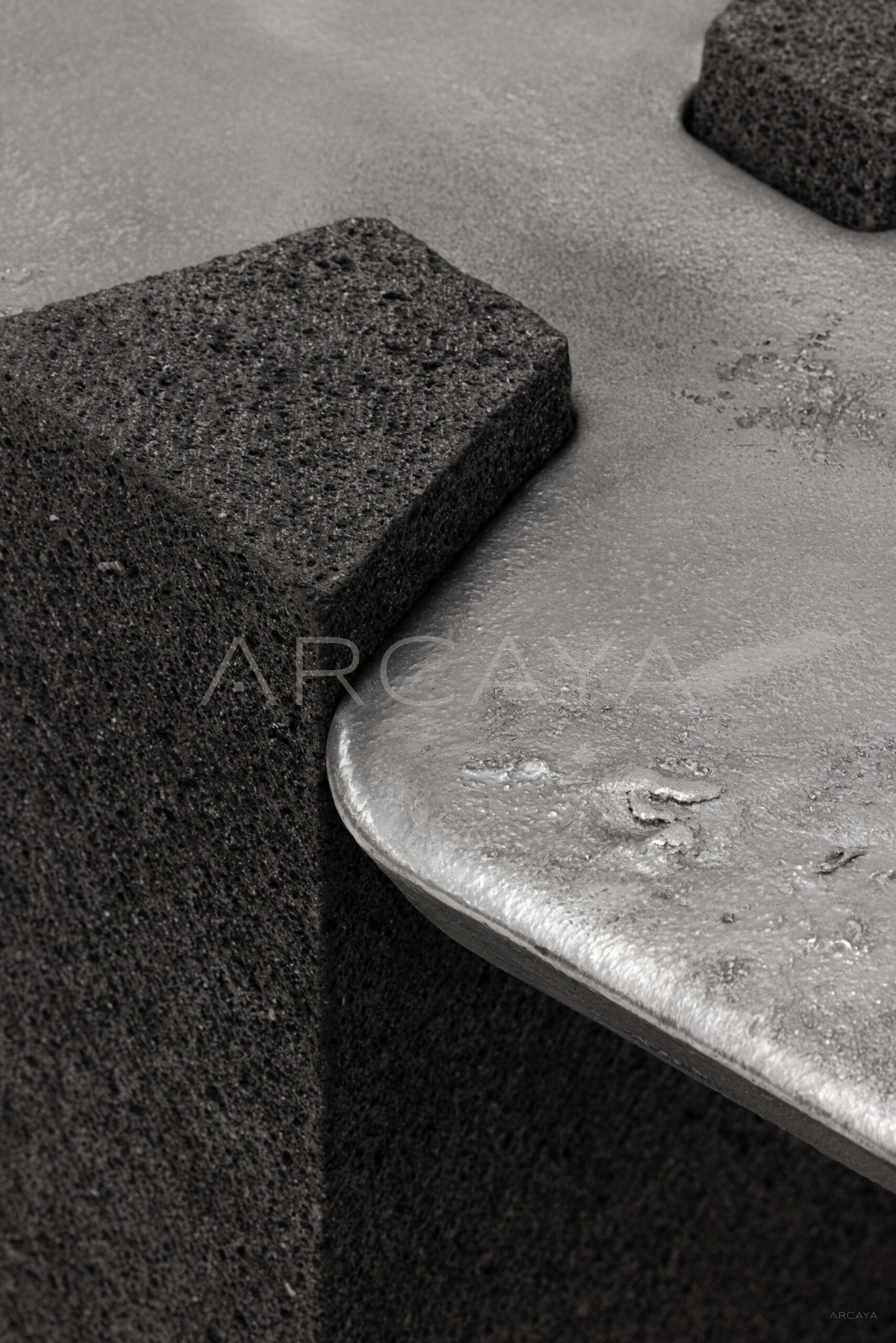 Exhuma Cast Metal Volcanic Stone Console Table - scene