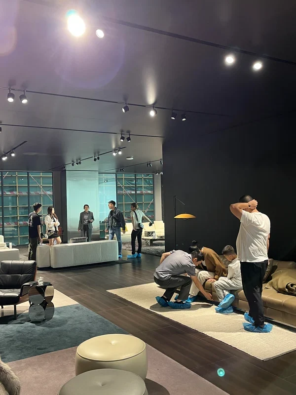 Arcaya team and clients reviewing furniture in a showroom