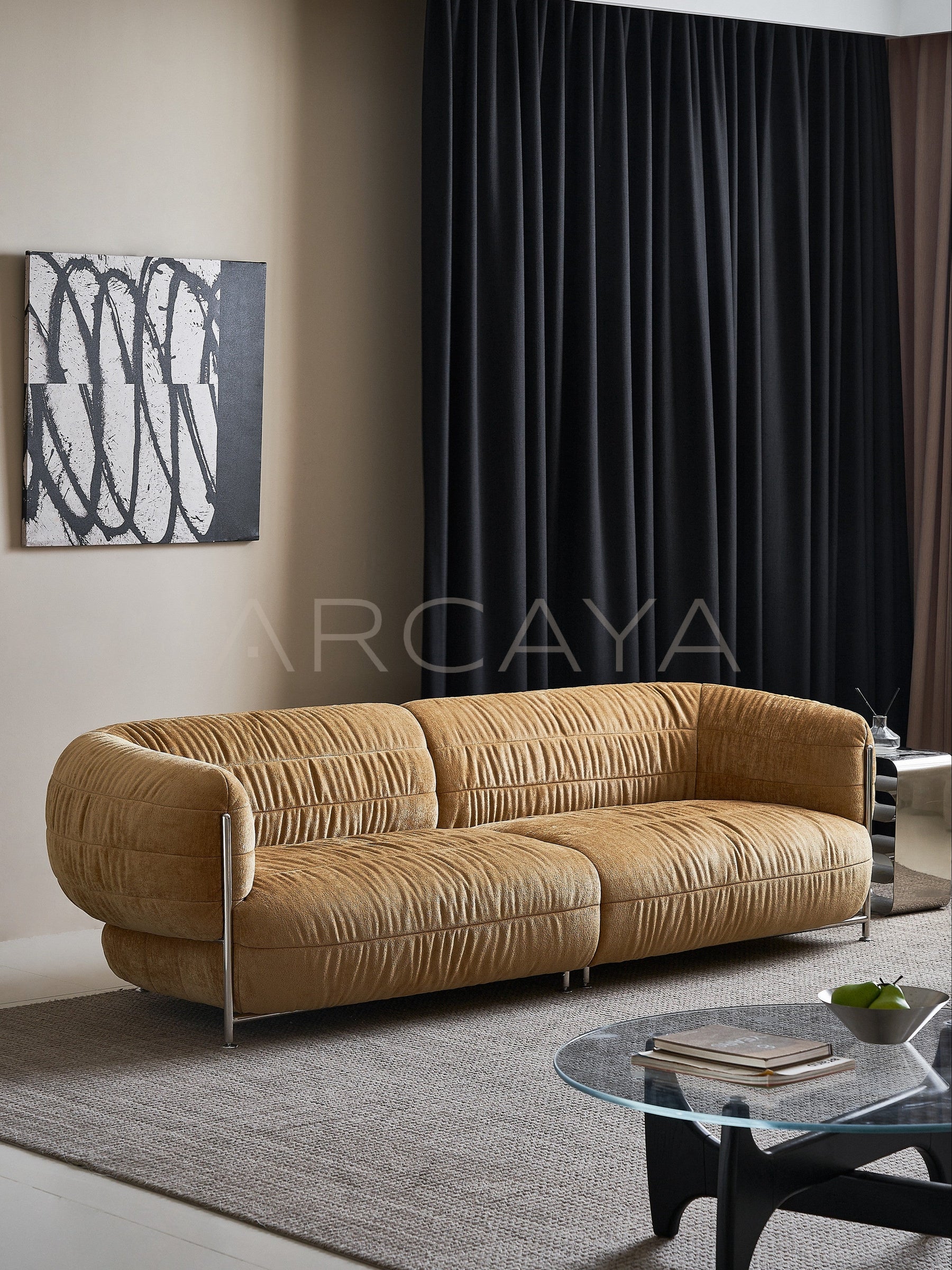 Willow Haven Sofa - golden brown sofa with gathered upholstery and metal supports in a living room