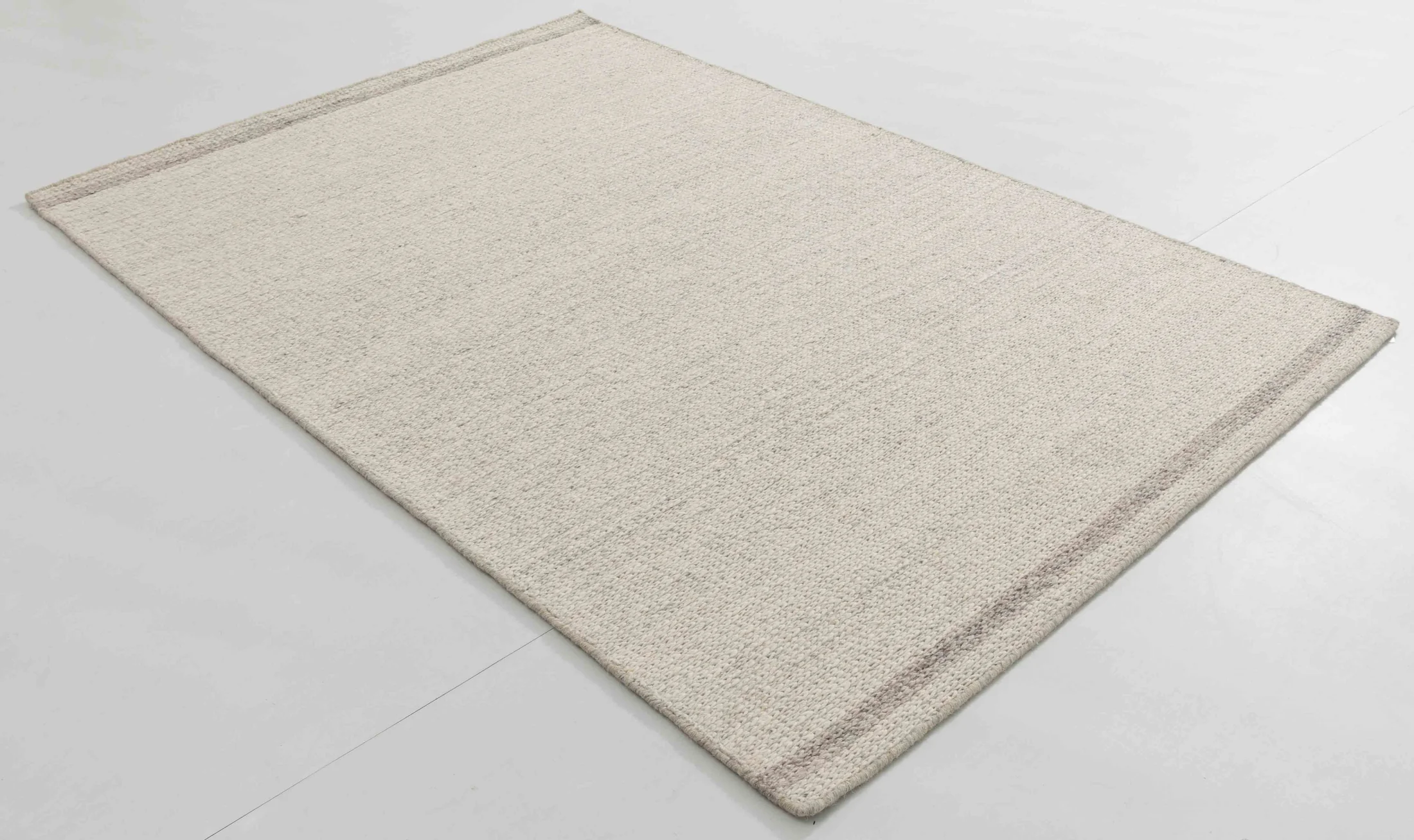 Bus Bloom Area Rug in a finished interior.