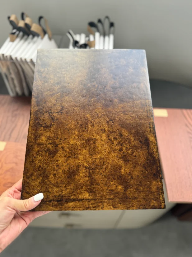 Wood veneer finish samples inspected for grain and color