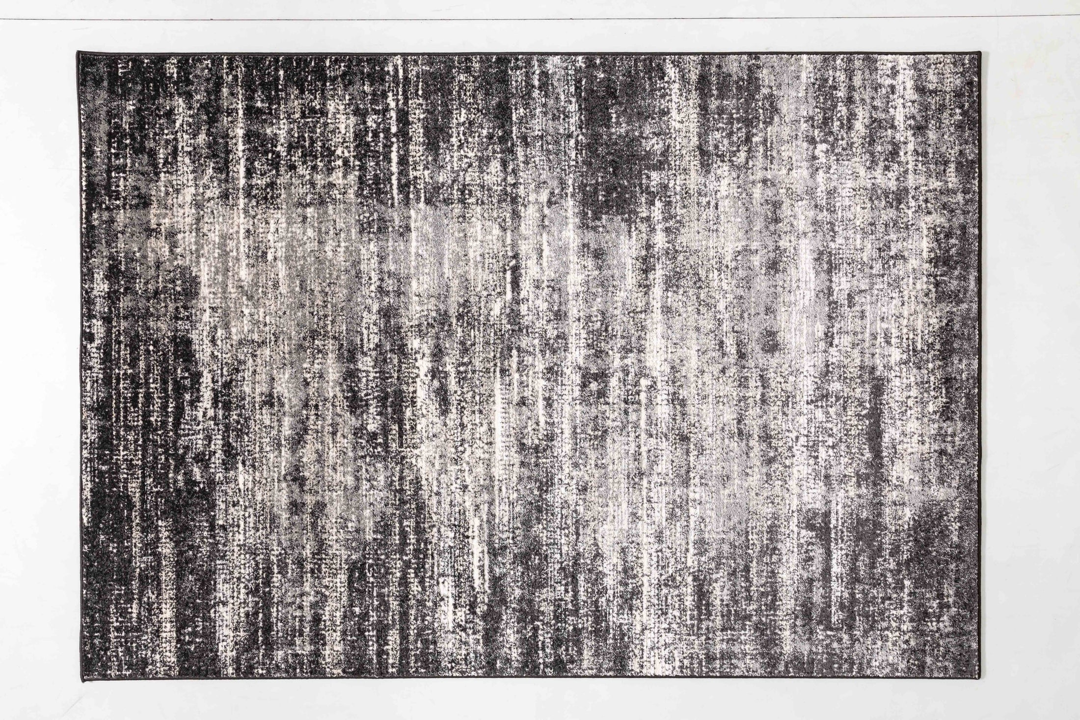 Grey Bloom Area Rug in a finished interior.