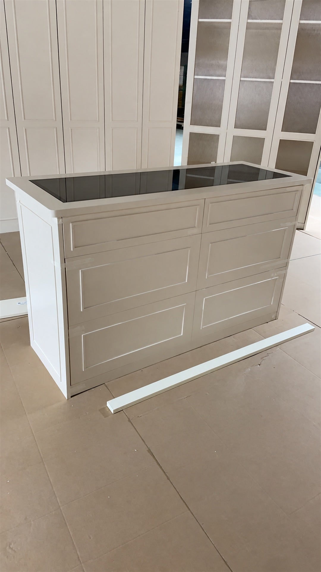 Island with the grey glass top and slim black frame fitted