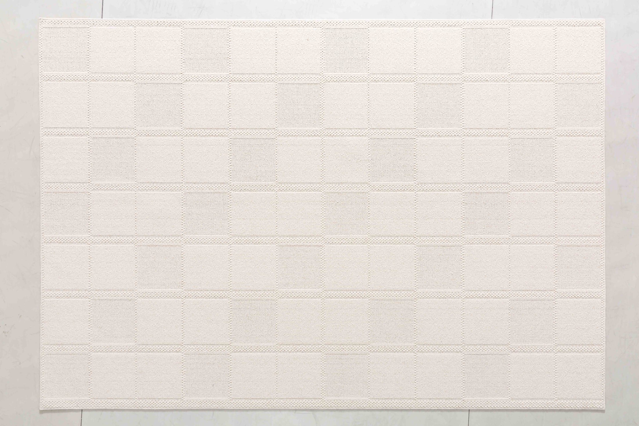 Wheat Cove Area Rug in a finished interior.
