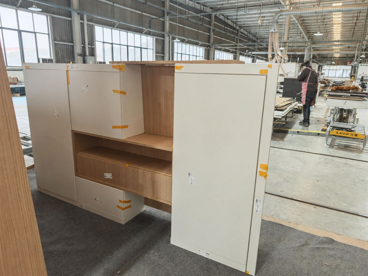 Oak and white cabinet assembly checked from the side