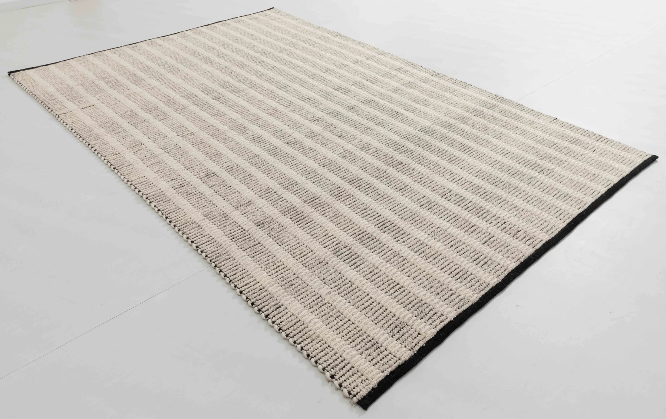 Harta Arc Area Rug in a finished interior.