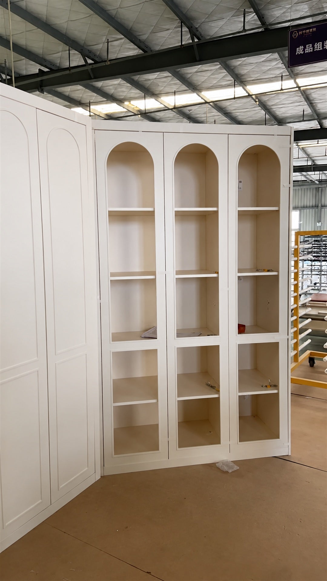 Arched glass display cabinet on the factory floor