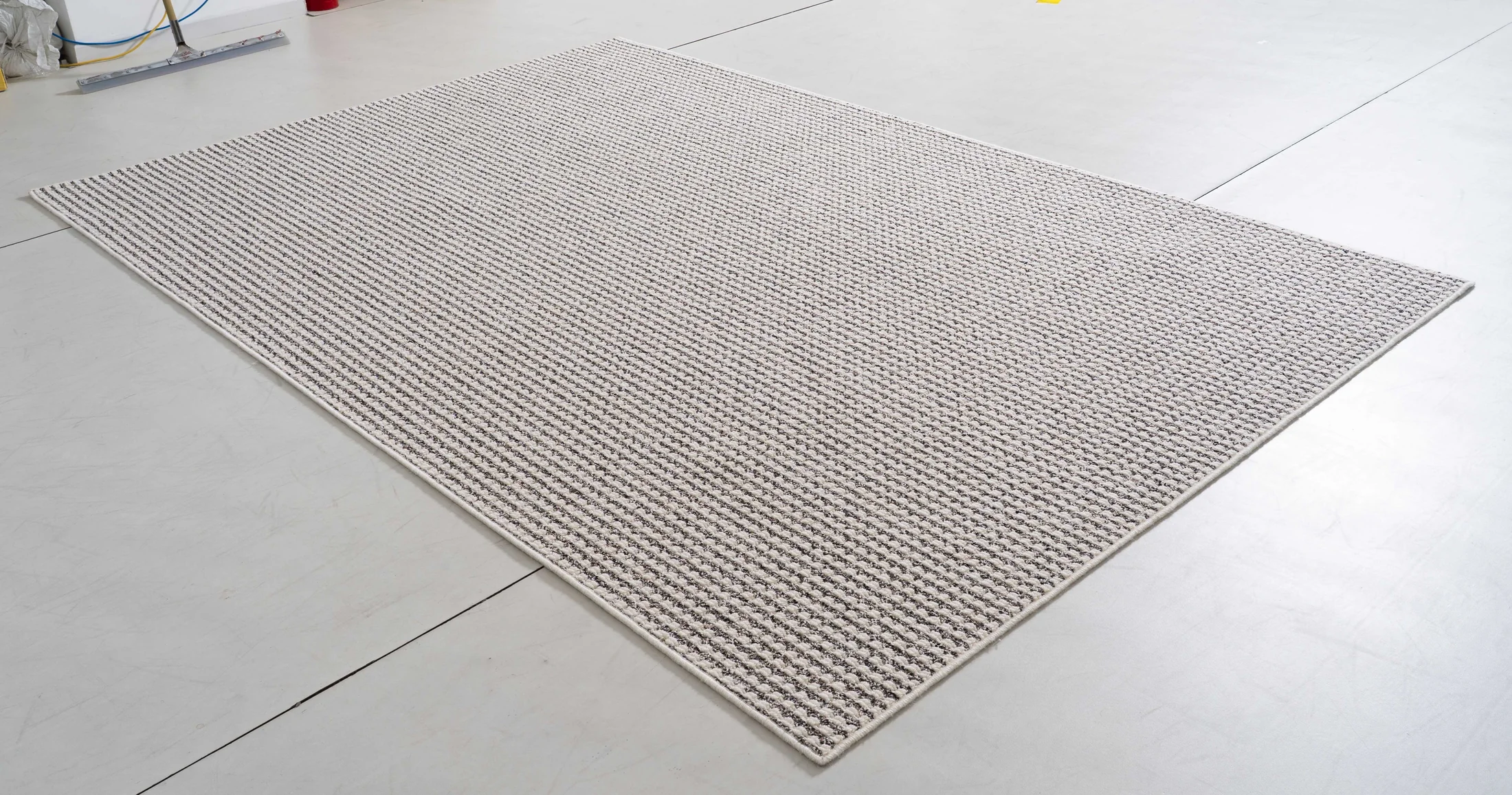 Midsummer Cove Area Rug in a finished interior.