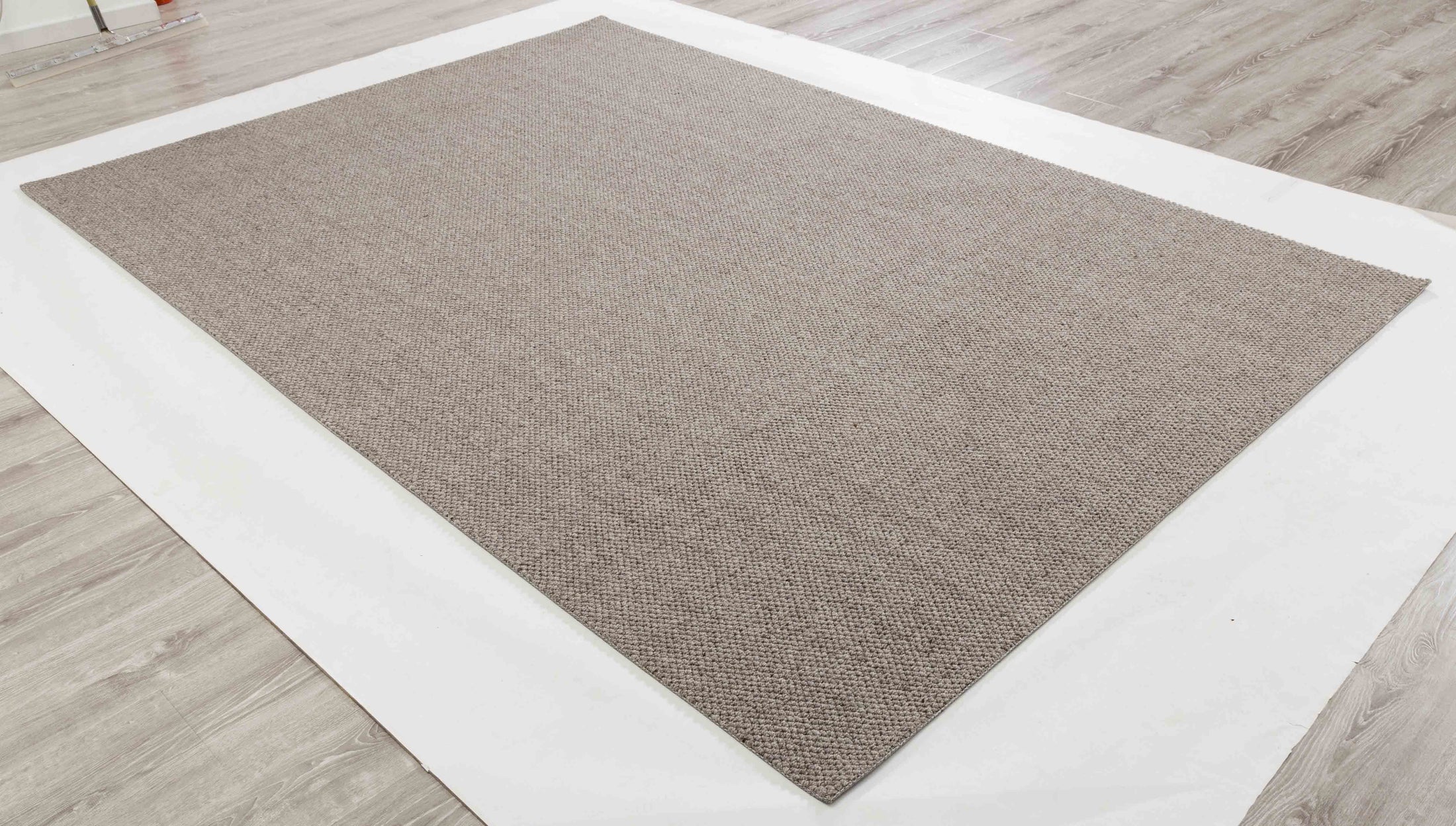 Plain Atlas Area Rug in a finished interior.