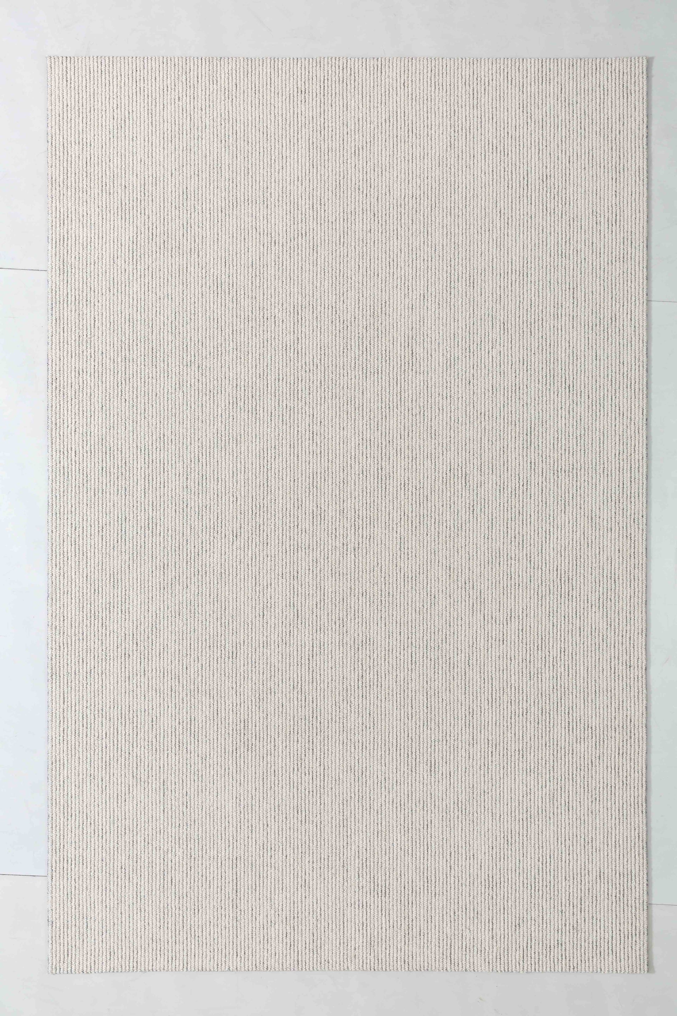 Frame Bloom Area Rug in a finished interior.