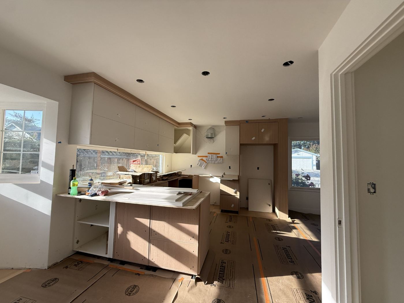 Wide view of the kitchen with all cabinet runs installed