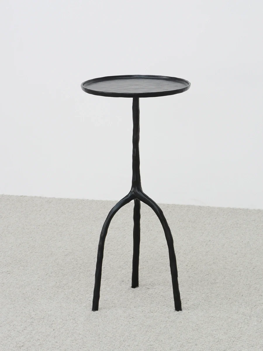 A00016 Side Table in a finished interior.