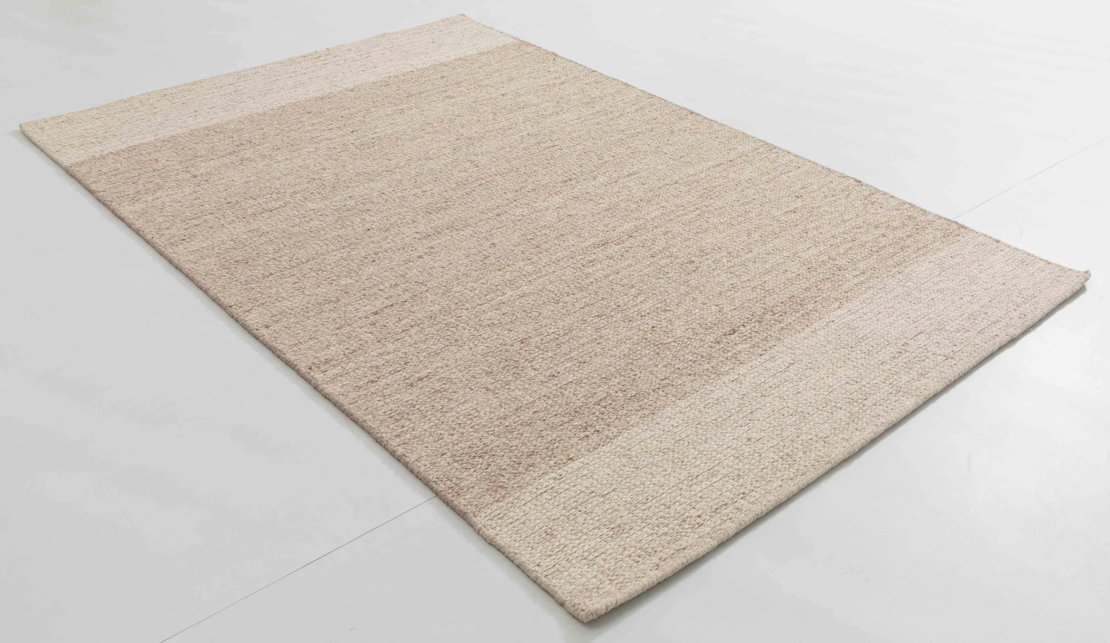 Bus Arbor Area Rug in a finished interior.