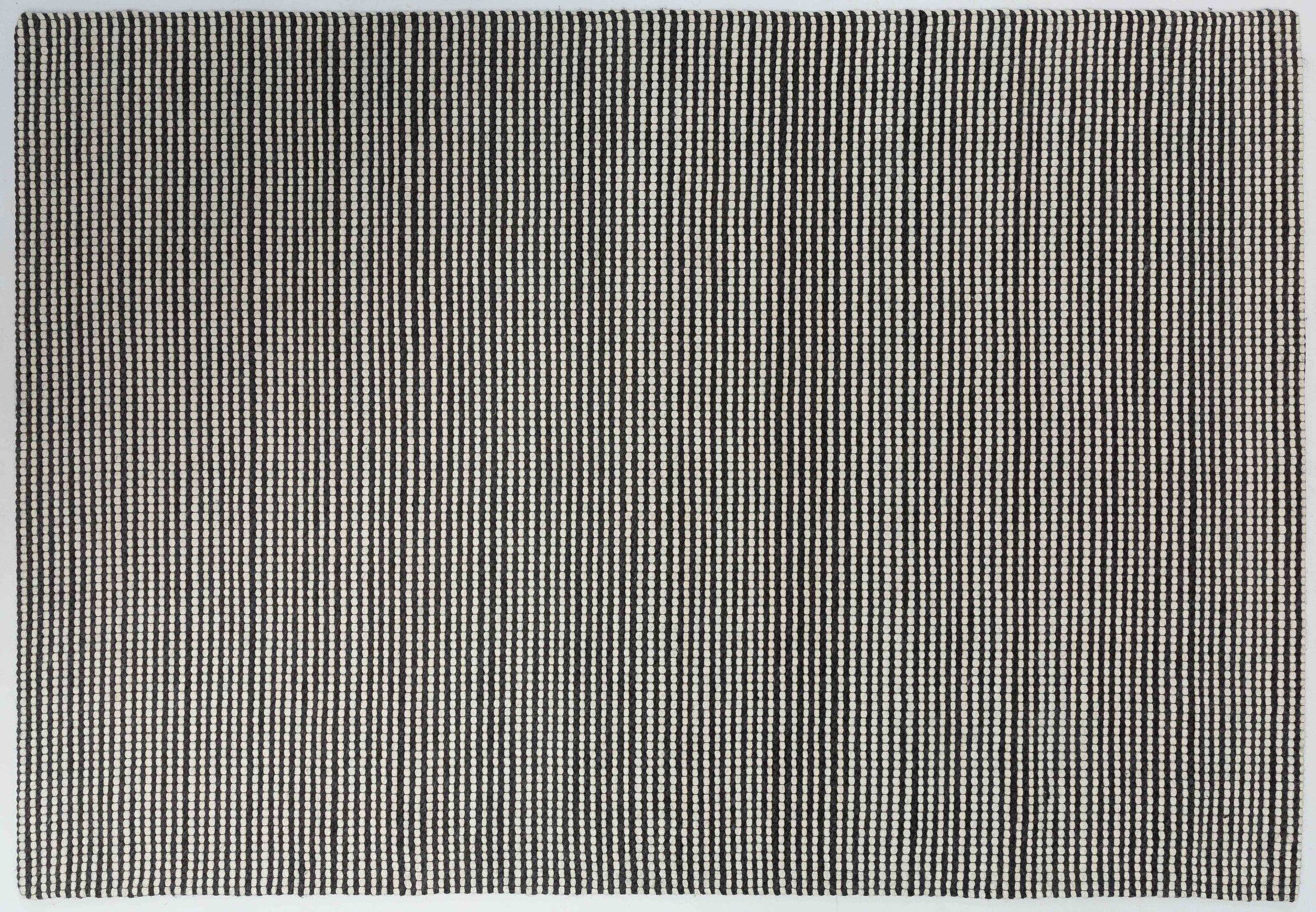 Cook Field Area Rug in a finished interior.