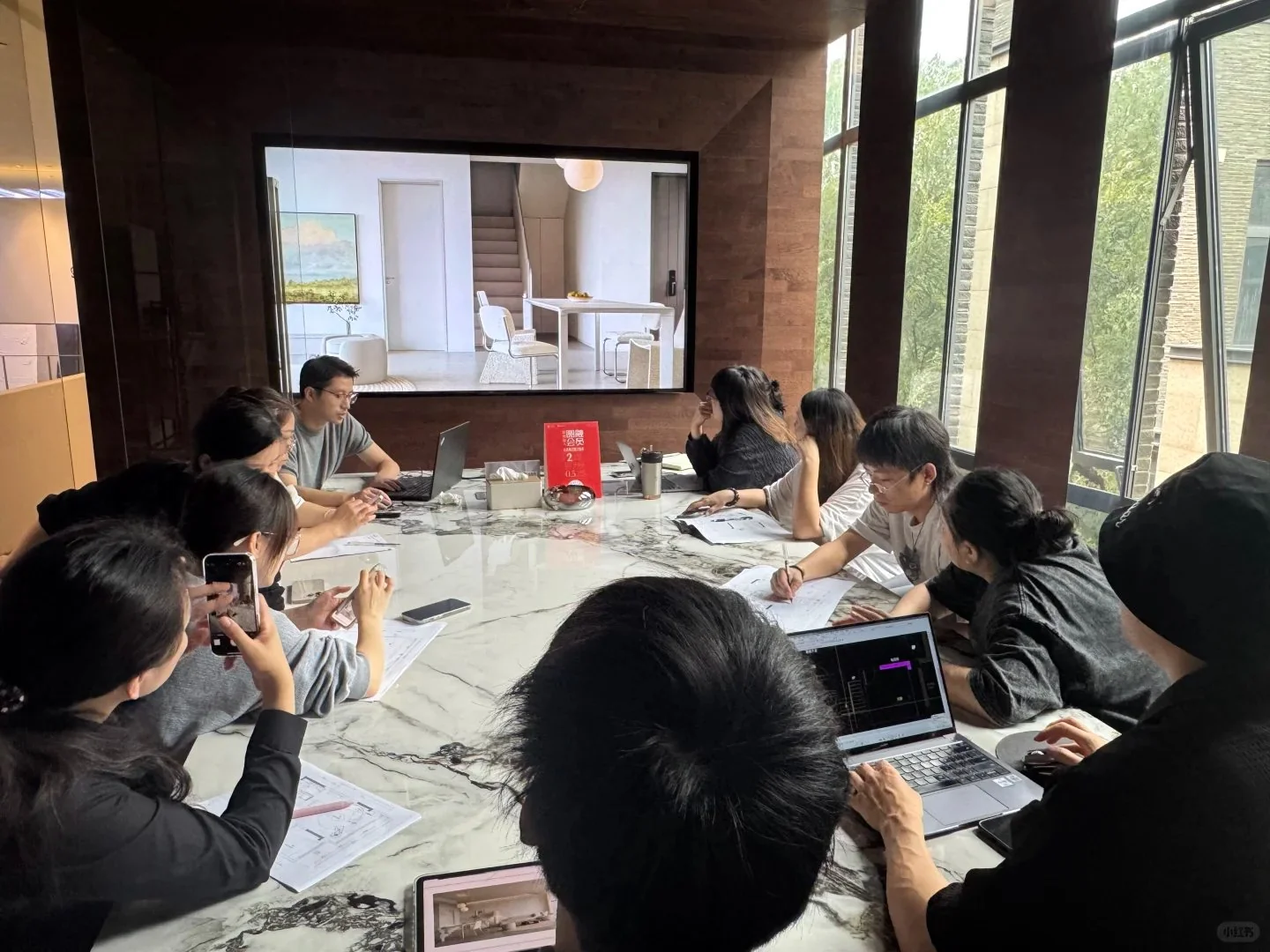 Arcaya team reviewing floor plans and furniture selections